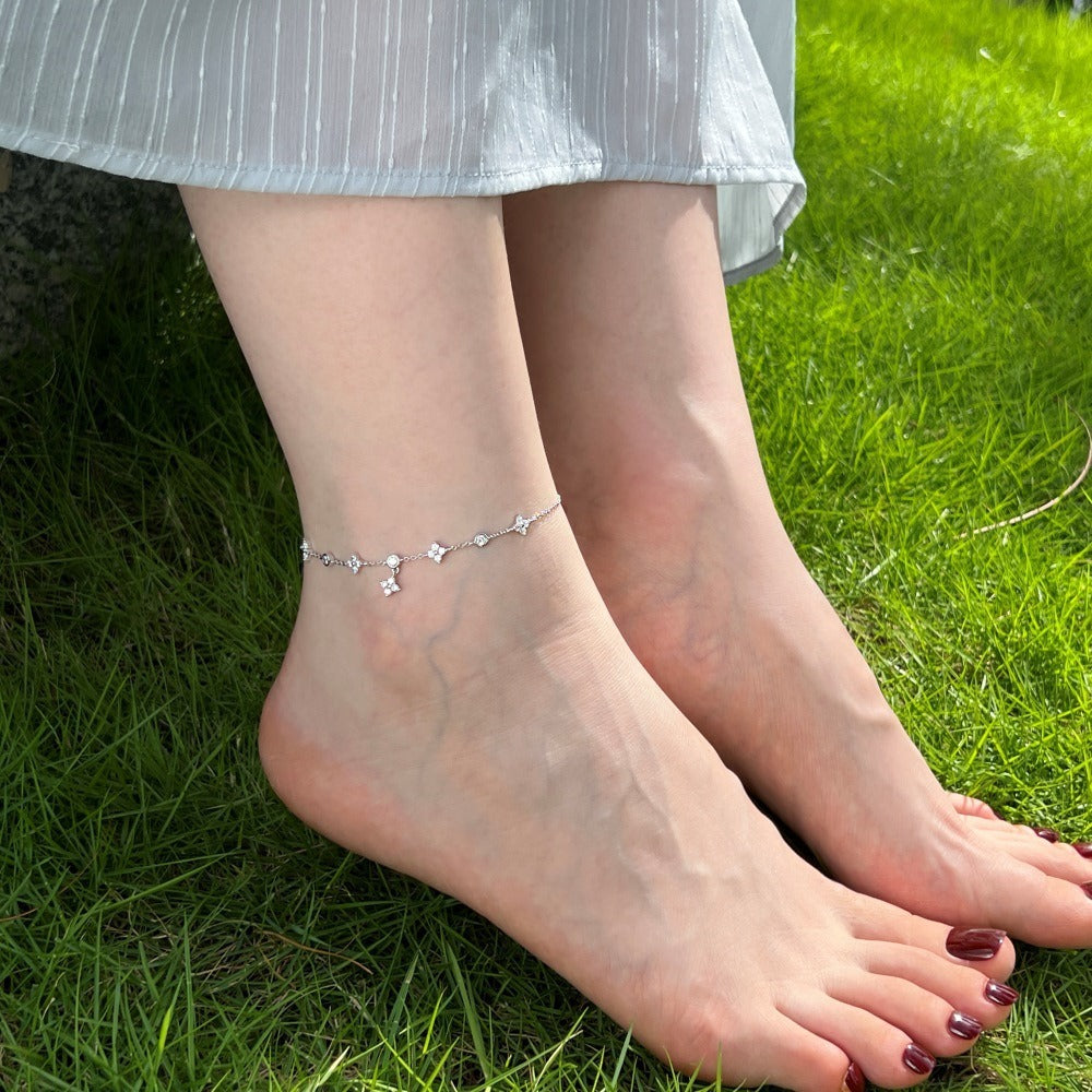 Good luck four leaf clover anklet on model’s foot, summer style jewelry