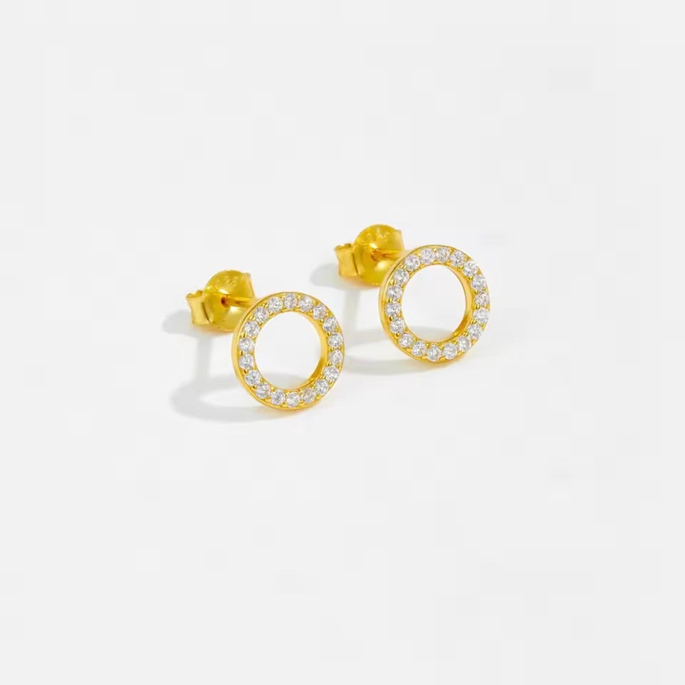Close-up of minimalist gold circle CZ earrings made with sterling silver, perfect for daily wear or holiday gifting