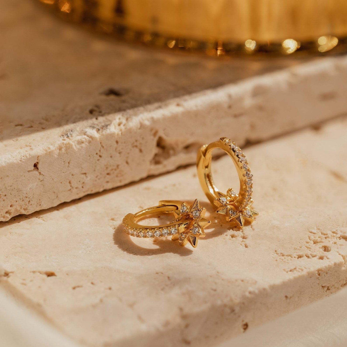 Removable star hoop earrings in gold-plated sterling silver with CZ details, styled as an elegant gift for Christmas or Valentine’s Day