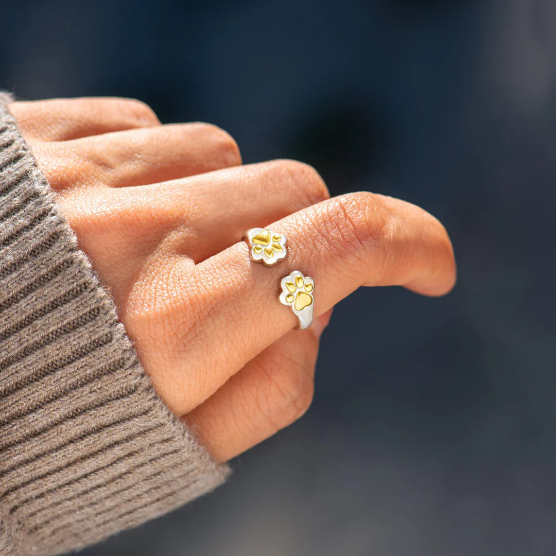 cute dog paw print rings in silver and gold for pet moms or animal lovers