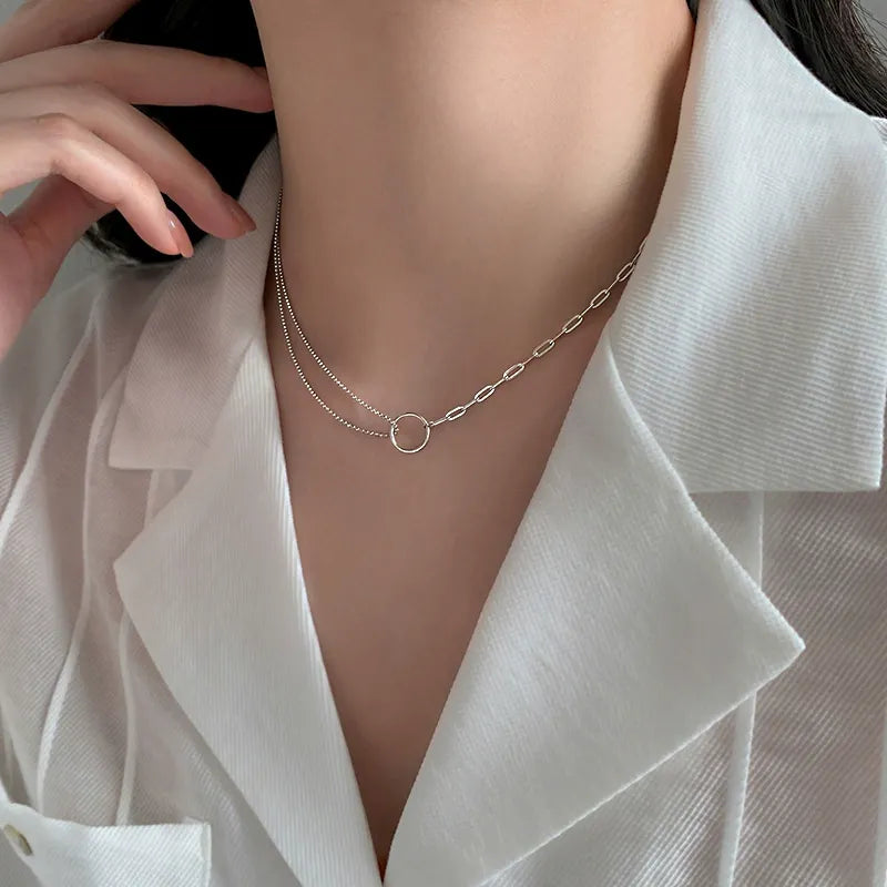 Set of 5 dainty layered silver necklaces featuring asymmetrical double ring pendants – perfect gift for her