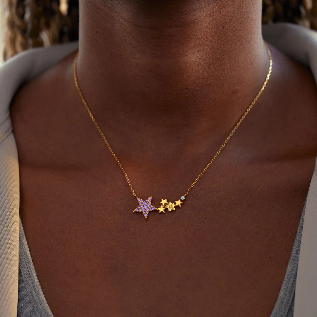 Elegant collarbone length sterling silver star necklace with colorful accents