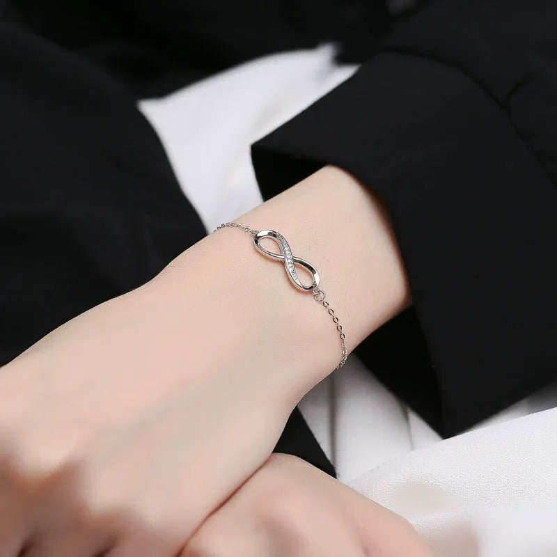 Elegant mother daughter bracelet with infinity symbol and cubic zirconia on fine silver chain
