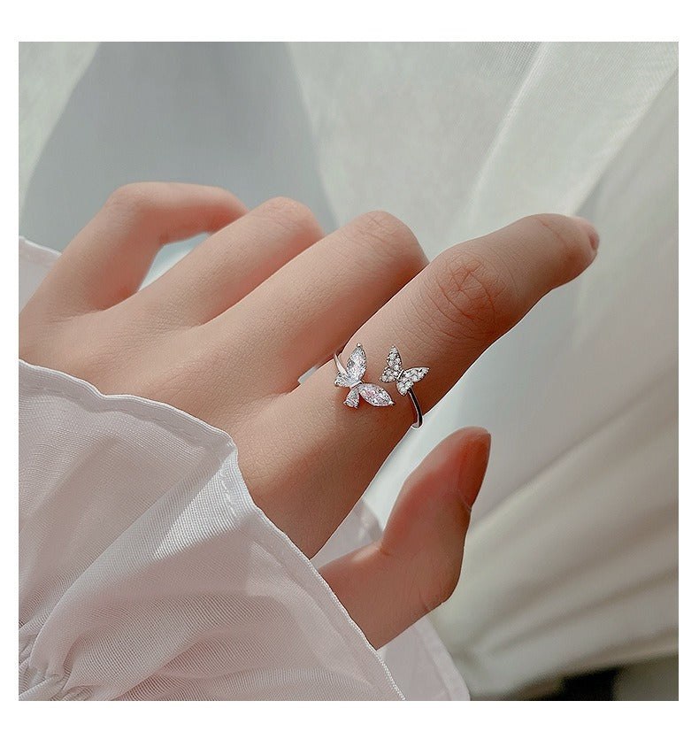 925 silver cubic zirconia butterfly ring styled on hand as minimalist jewelry
