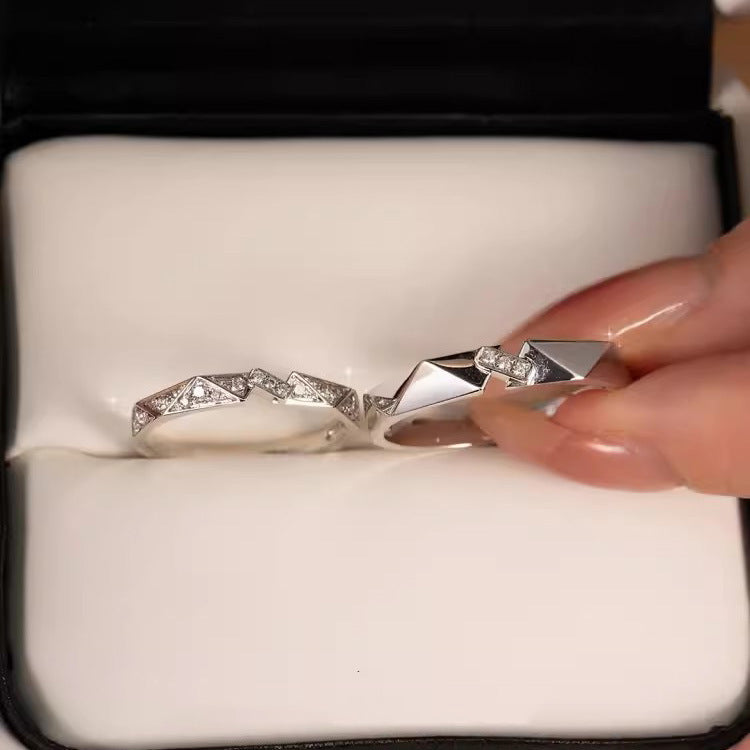matching silver rings for couples with angular origami-inspired surfaces