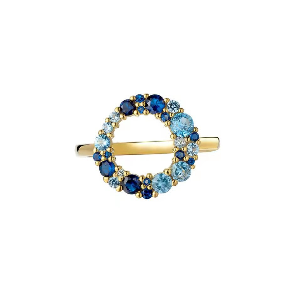 single blue cubic zirconia ring in sterling silver with minimalist polished band
