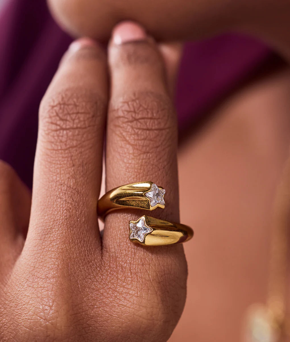 Alt text: Gold star shaped ring with sparkling zircon adjustable fit elegant fashion jewelry for women