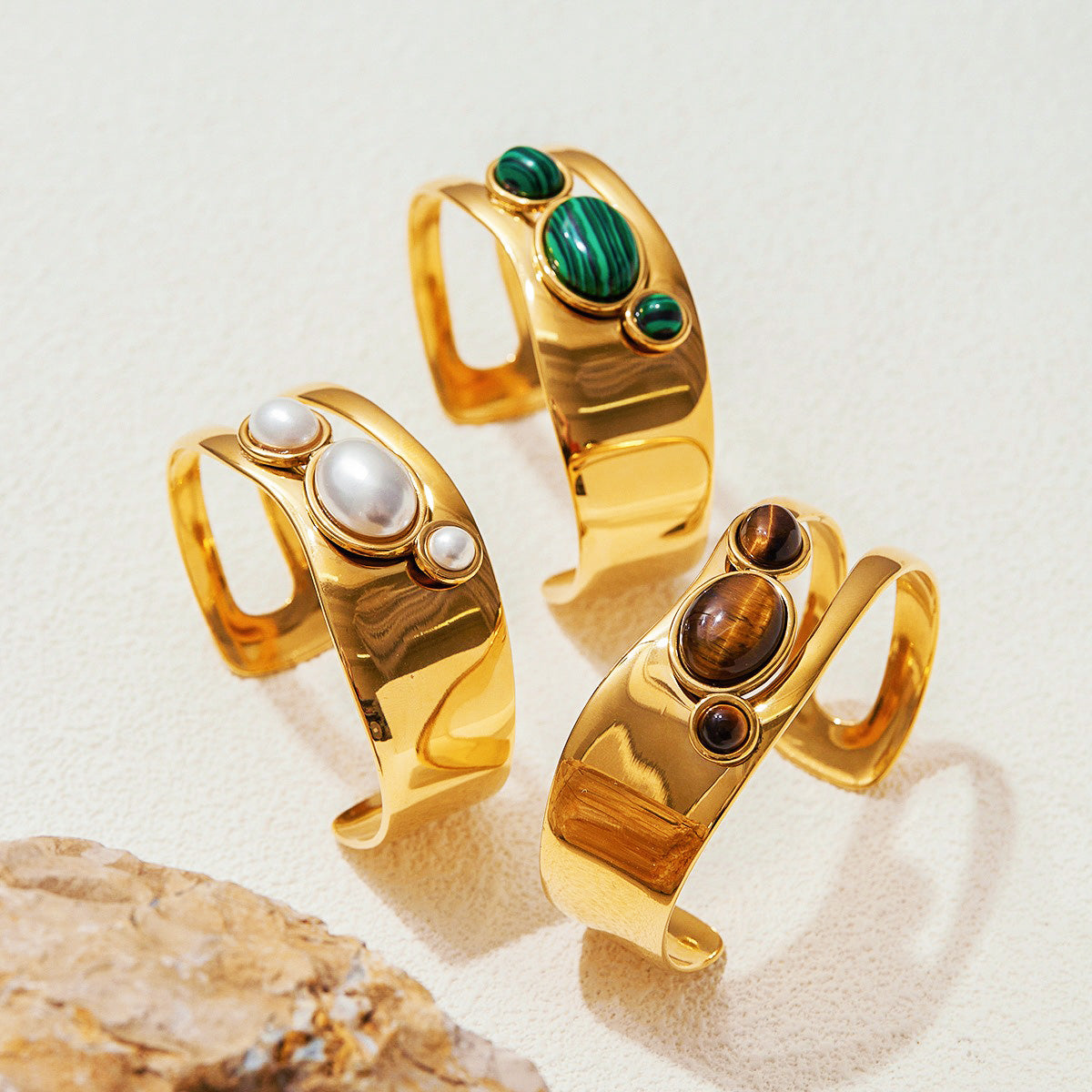 Set of 5 gold gemstone cuff bracelets with natural pearls and tiger eye stones designed as boho jewelry perfect for small Valentines gifts for her or boutique wholesale.
