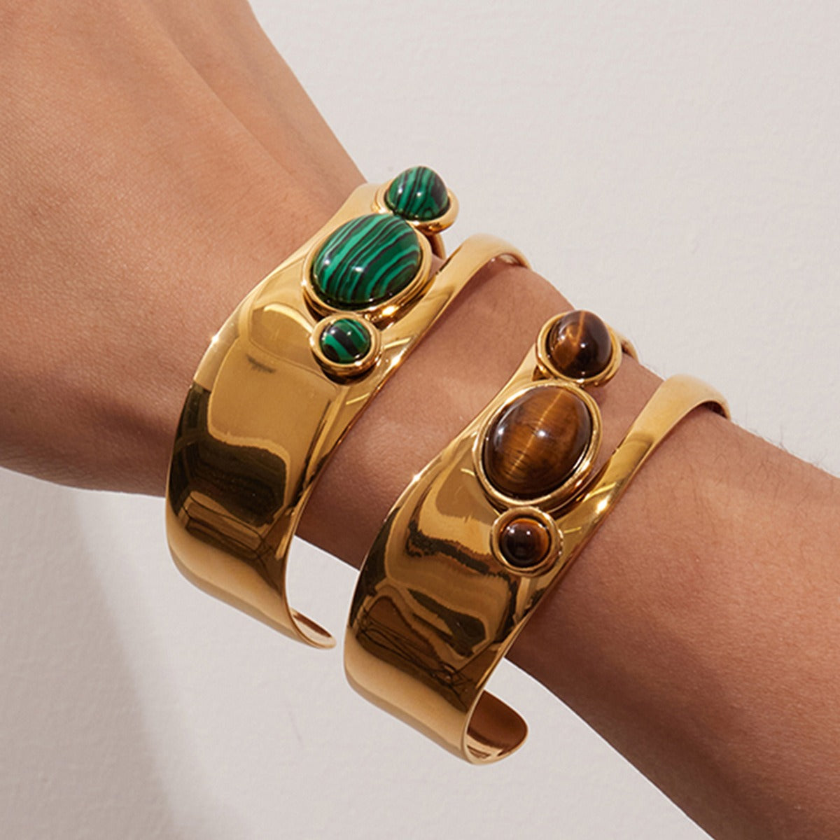 Gold pearl and tiger eye cuff bracelets styled as boho jewelry worn on wrist great for natural stone lovers and small Valentines gifts for her.