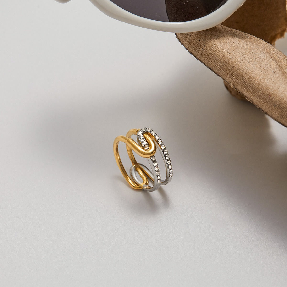 Close-up of trendy summer two tone fashion ring with sparkling rhinestones
