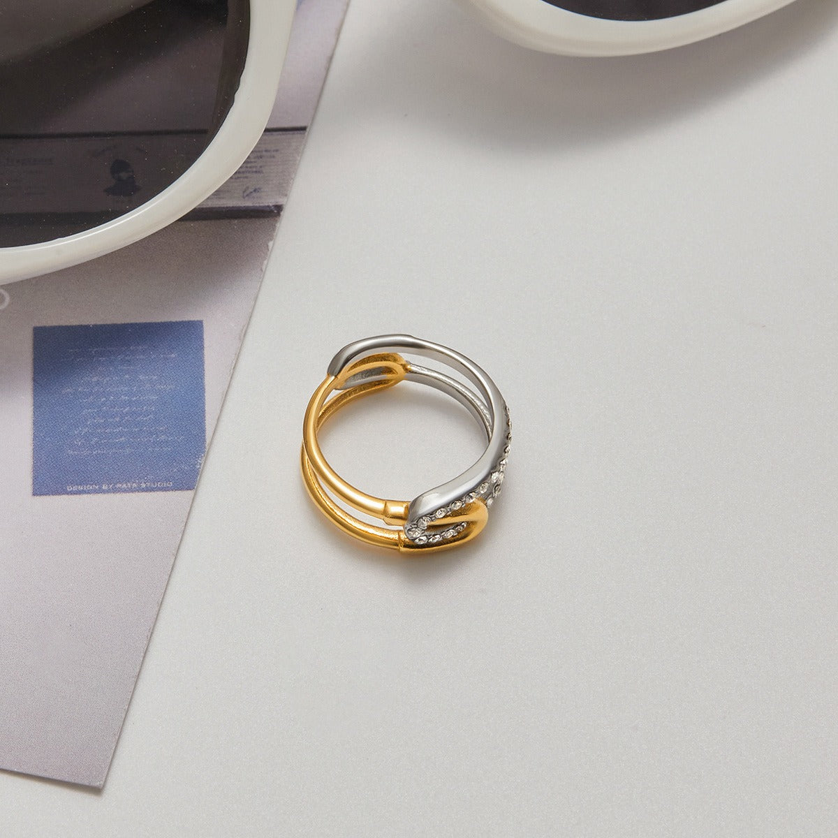 Chic stainless steel rhinestone ring in mixed metal design for stylish looks
