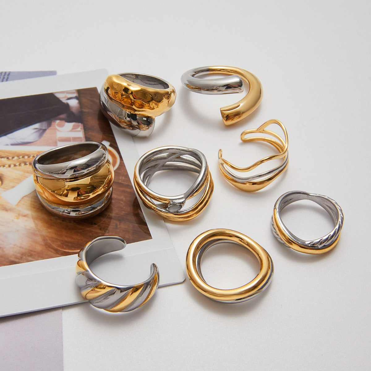 Set of 10 two tone rings in stainless steel featuring modern gold and silver mix styles, ideal for boutique fashion jewelry and non tarnish ring sets.