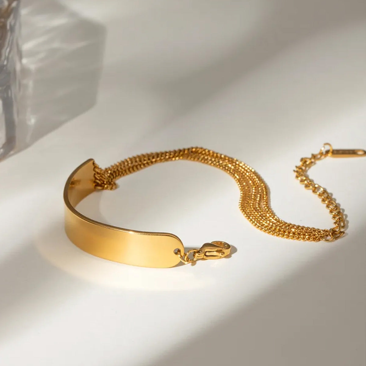 Elegant dainty chain bracelet gold style with polished surface and layered chains, showcasing a chic chain bracelet womens gold look for everyday or party wear.