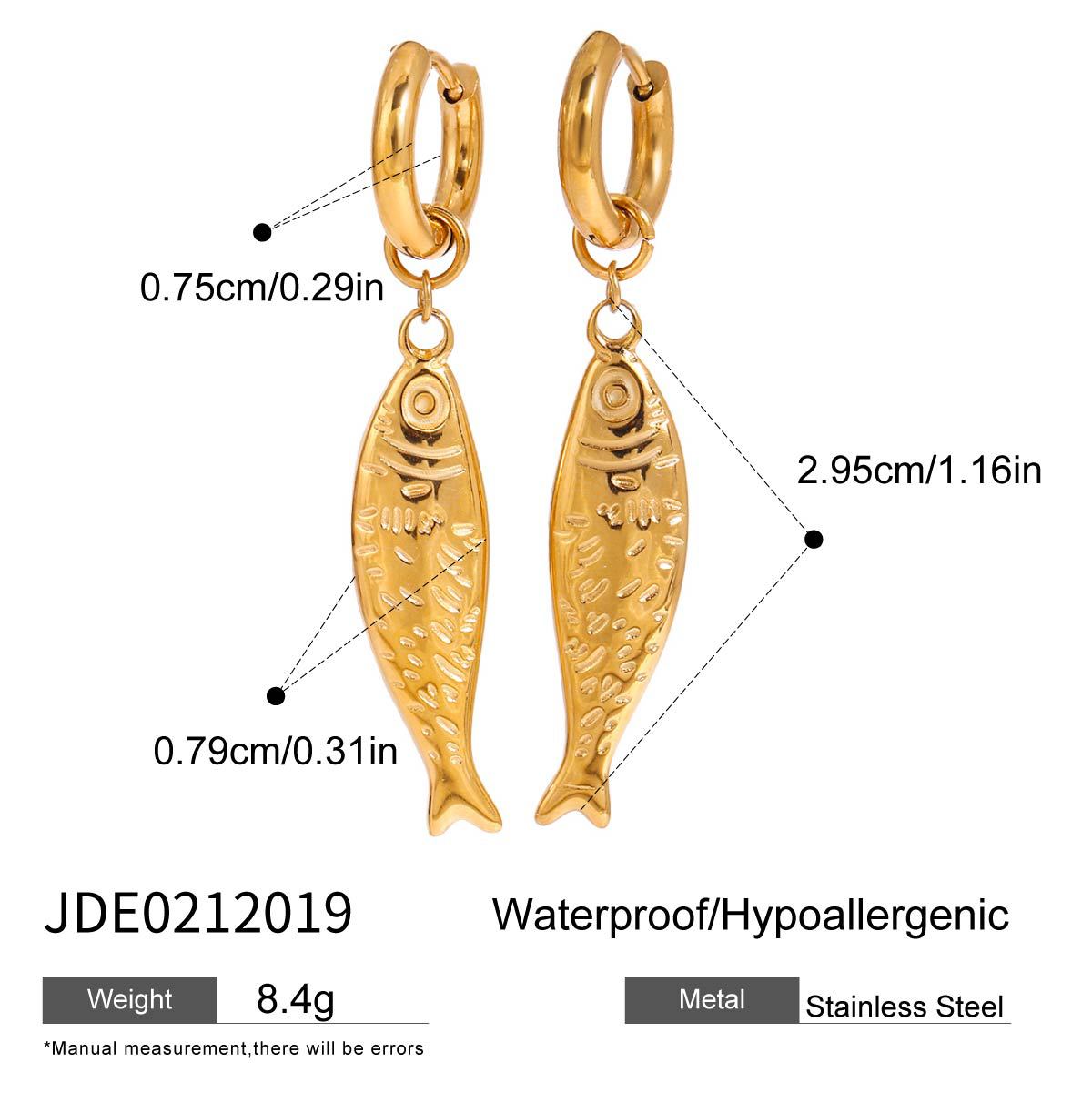 Matching gold fish necklace and earrings set displayed on stone with seashells. Made of stainless steel and 18k gold plated, ideal for beachwear or vacation jewelry.