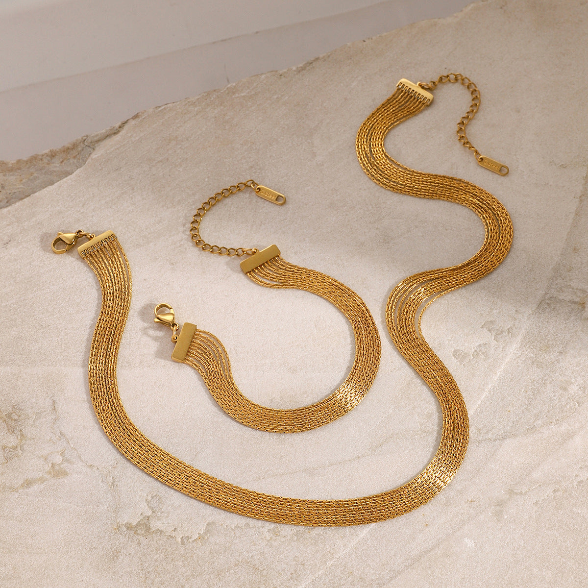 Elegant gold layered necklace and bracelet set styled with natural stone. This matching jewelry set is a perfect gift and fashionable stackable jewelry for girls.