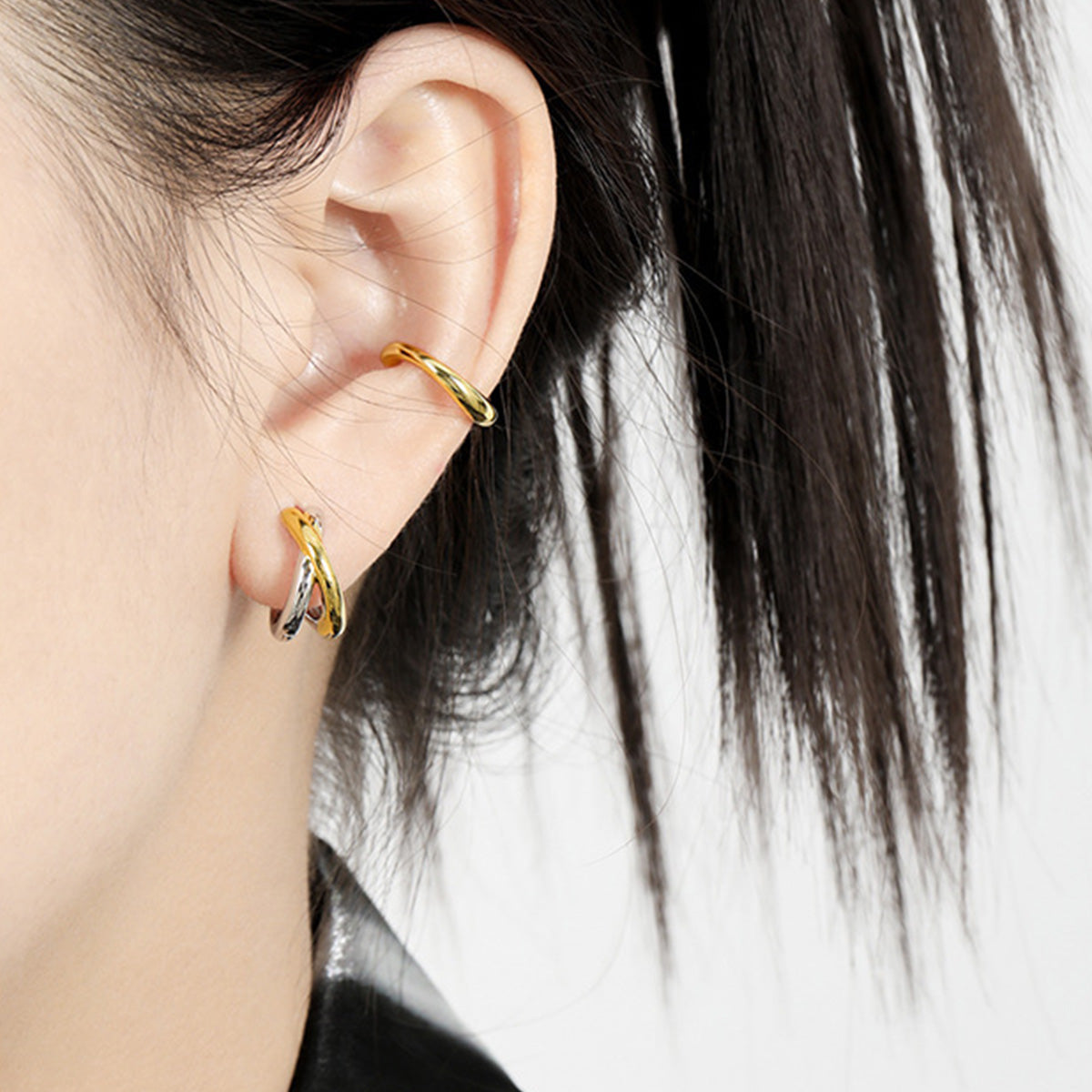 Daily wear knot hoop earrings for women, wholesale 925 sterling silver earrings in a two tone minimalist style.
