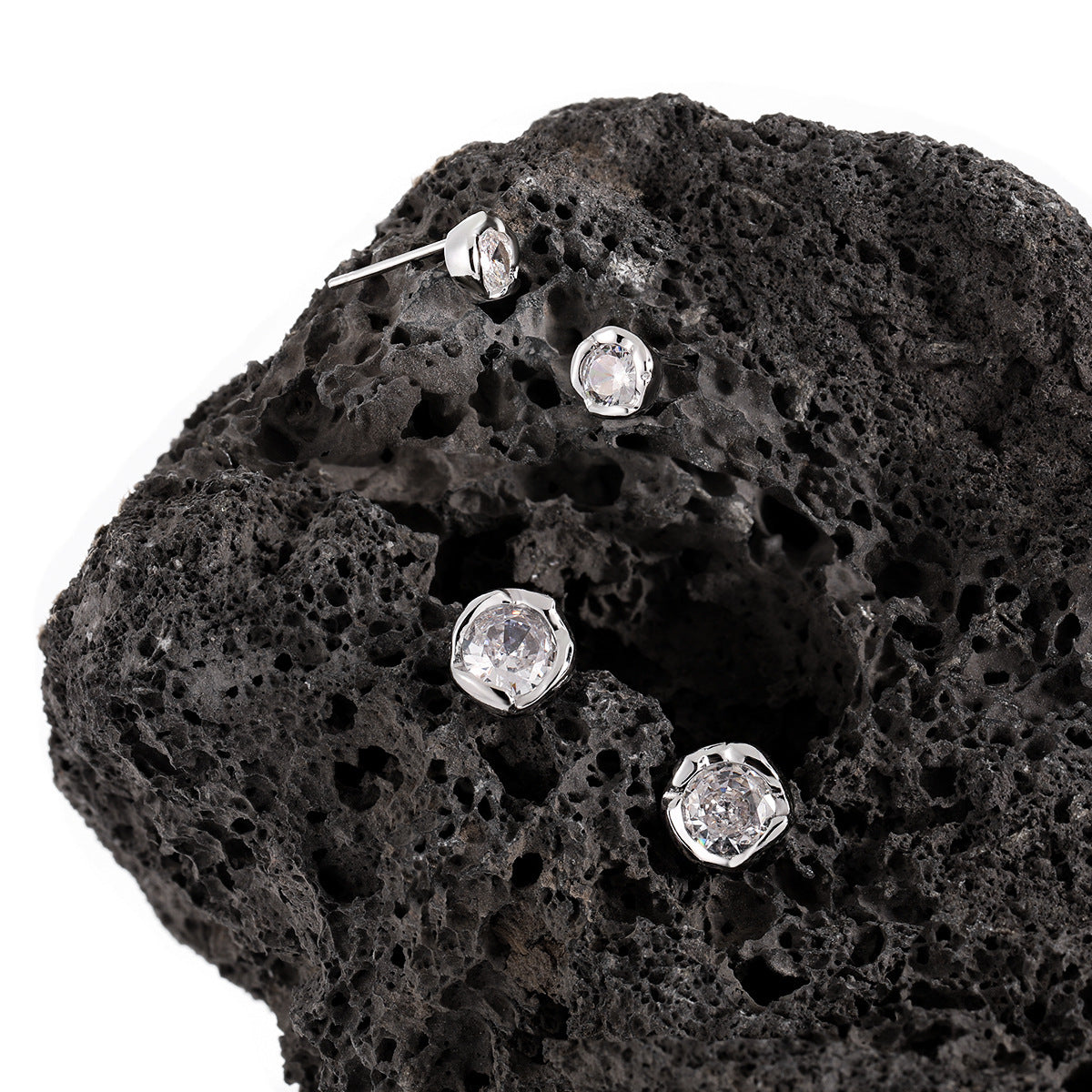 Small size 925 sterling silver CZ stud earrings worn on model, hypoallergenic earrings for women wholesale with minimalist chic design.