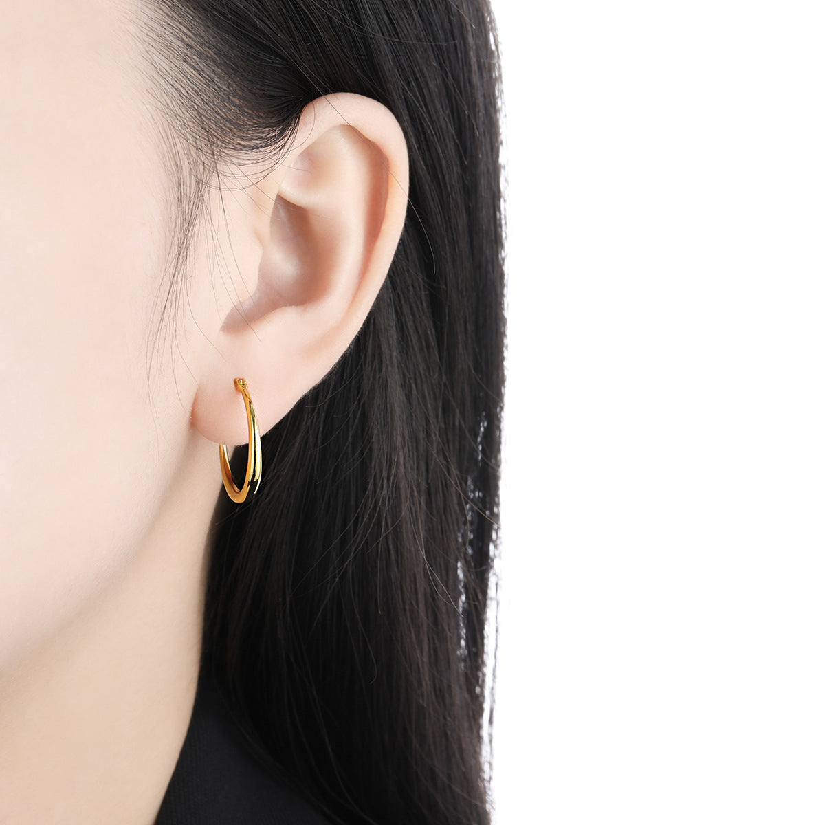 Model wearing 18K gold plated hypoallergenic 925 silver hoop earrings 20mm wholesale jewelry