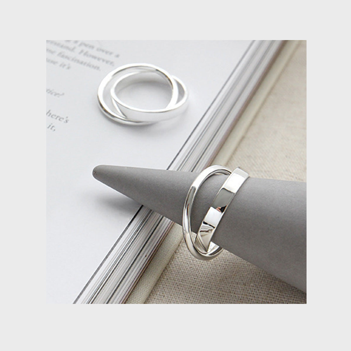 925 silver double loop rings on display cone perfect for minimalist jewelry wholesale and boutique resellers