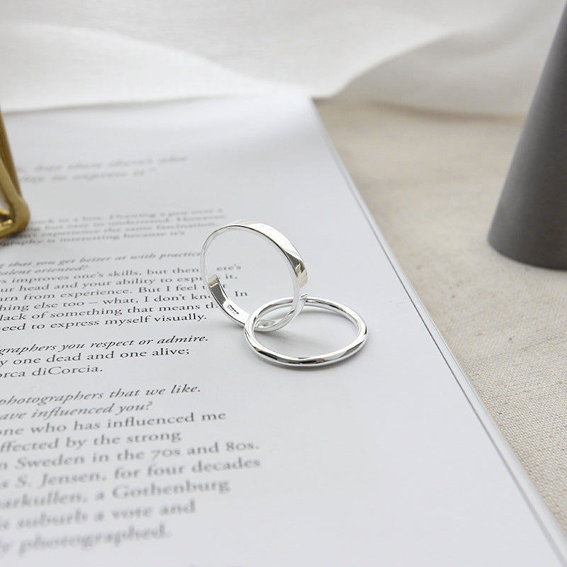 Stacked 925 sterling silver rings in minimal loop design featured in minimalist jewelry wholesale set of 5