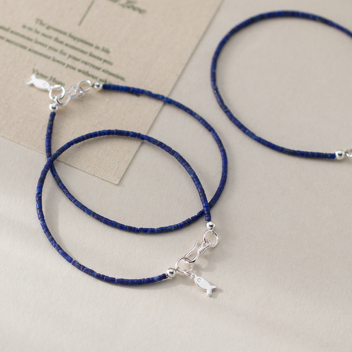 Wholesale lapis lazuli lucky fish bracelet in 925 sterling silver, ideal for boutique jewelry wholesale suppliers