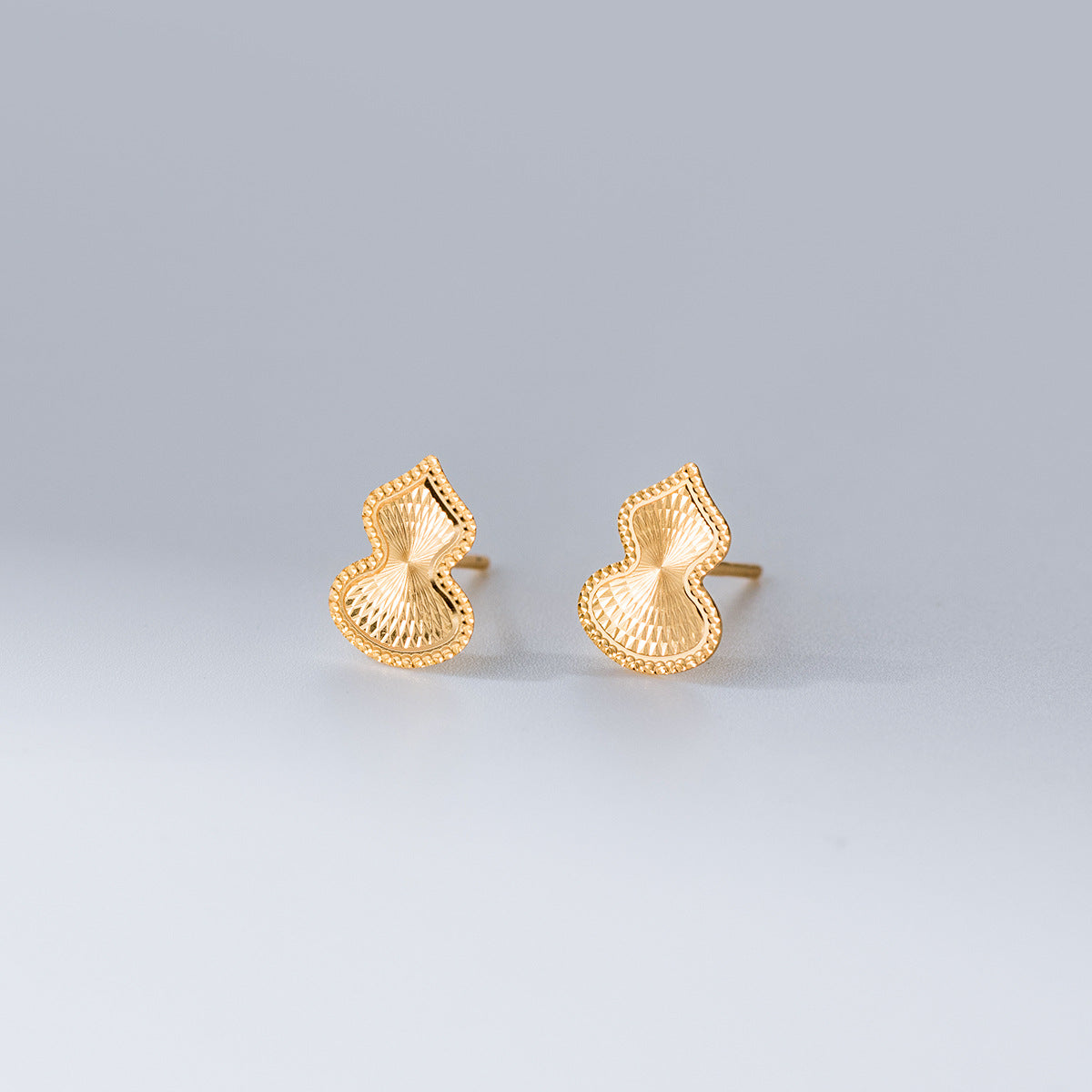 Gourd shape wholesale 925 sterling silver stud earrings in gold, unique laser cut earrings for bulk orders.