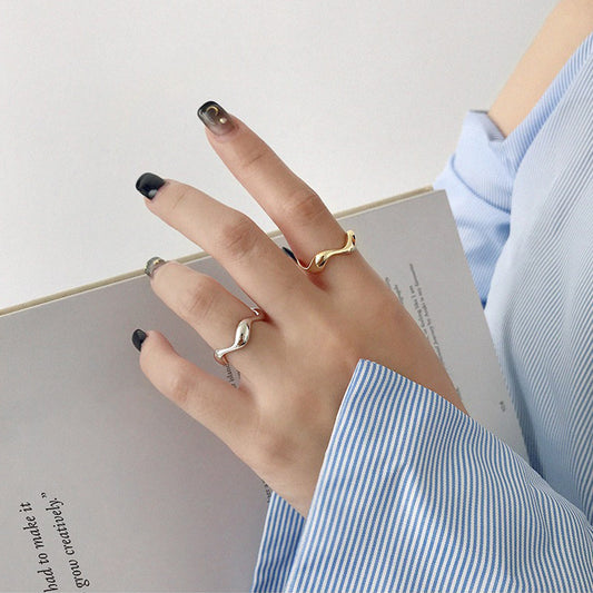 Model wearing minimalist wavy adjustable rings set wholesale 925 silver
