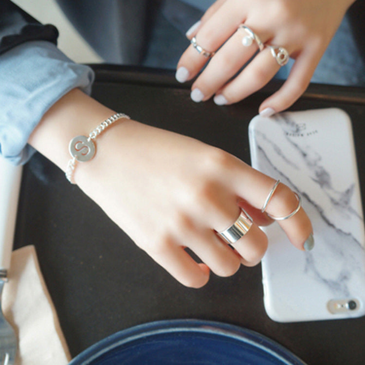 925 silver wide ring worn with minimalist stack rings, perfect for minimalist jewellery wholesale collections