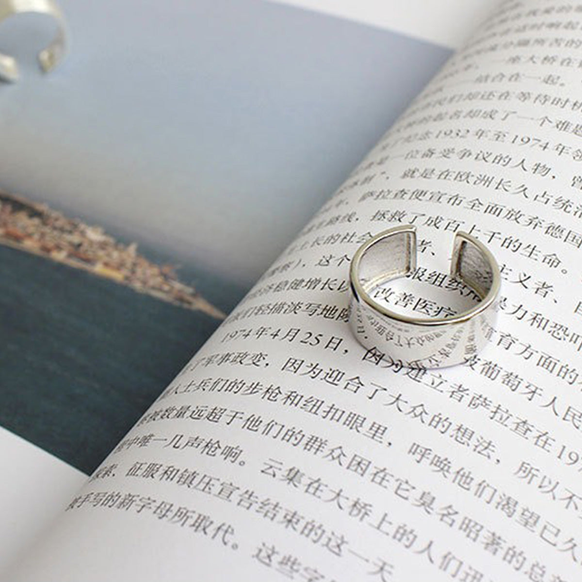 close-up of 9mm wide sterling silver ring on book, ideal for everyday jewelry and wholesale minimalist ring suppliers
