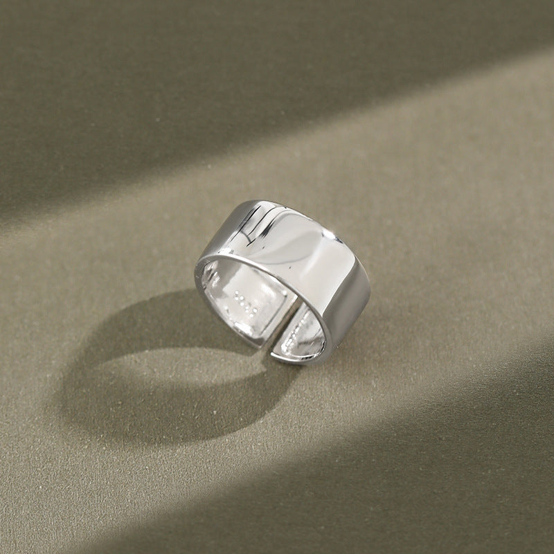adjustable 925 silver wide band ring displayed in natural light, shining everyday jewelry for wholesale customers
