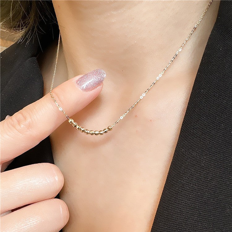 Model wearing 925 sterling silver 18K gold plated faceted bead choker, great for wholesale jewelry and seasonal gift markets like Valentine’s Day or Christmas.