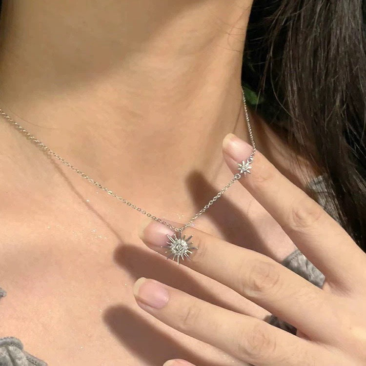 925 silver sunburst pendant necklace shown close on model