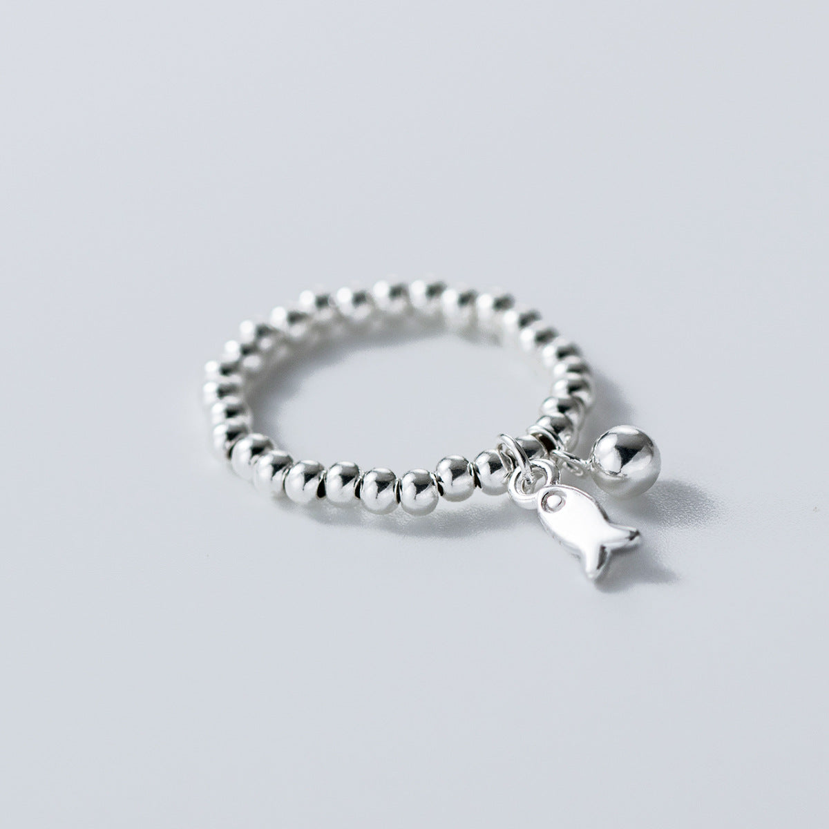 Close-up of wholesale sterling silver 925 beaded fish pendant ring, minimalist jewelry for women gift set