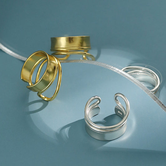 Gold and silver double band 925 rings on display, showcasing styles in minimalist jewelry wholesale and kpop style rings for boutique bulk orders.