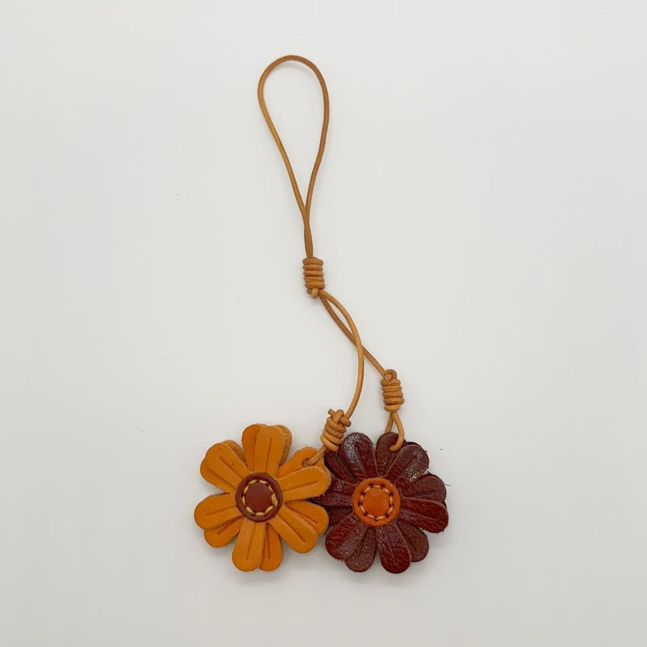 Brown and maroon leather flower bag charms, handmade keychains for creative gift idea and cute bag accessories wholesale.