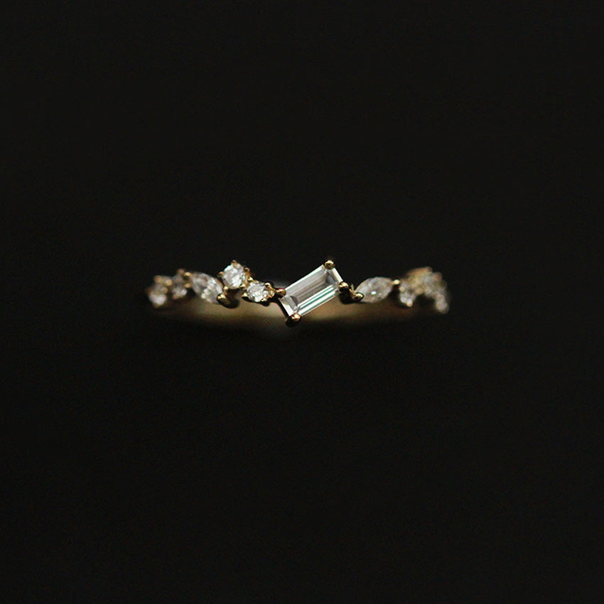 Delicate emerald cut zircon ring worn on finger showcasing minimalist luxury styling
