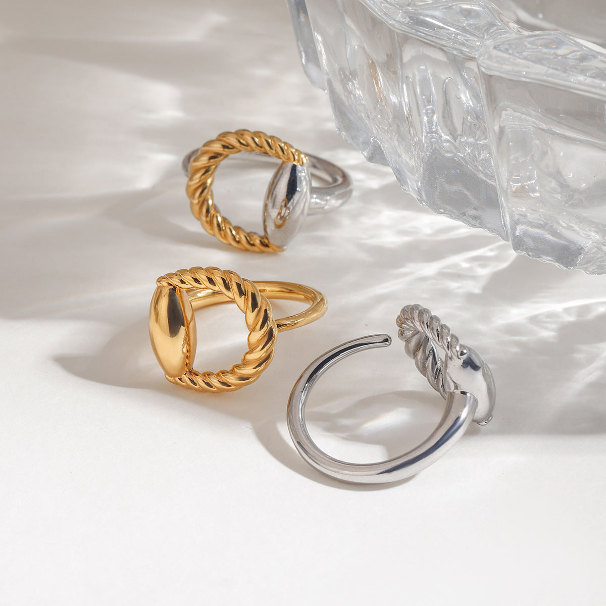 Wholesale stainless steel rings with 18K gold stainless steel twisted oval design, adjustable jewelry set.