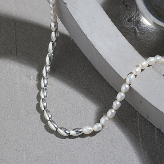 Close-up of silver rice beads and natural freshwater pearls on an S925 sterling silver necklace, perfect for wholesale and ins style jewelry collections.