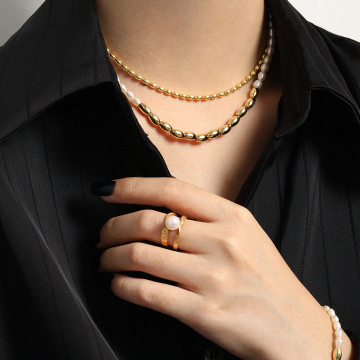 Close-up of gold rice beads paired with natural freshwater pearls on an S925 sterling silver necklace, ideal for wholesale and Korean Style jewelry trends.