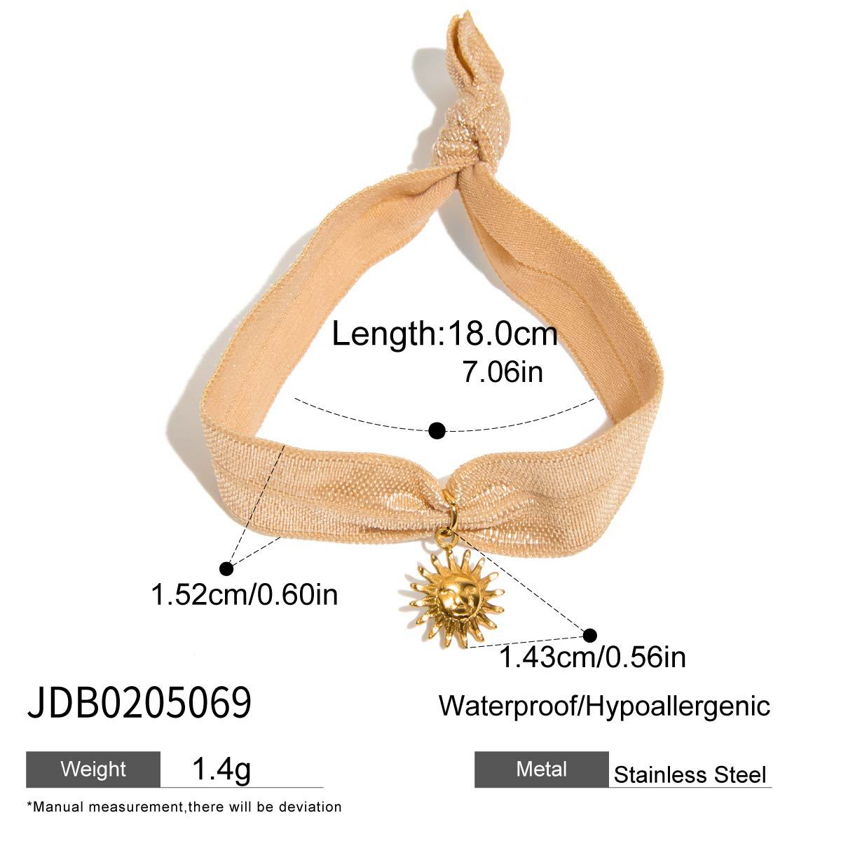 Beige sun charm bracelet with elastic ribbon and gold stainless steel charm, lightweight and designed for wholesale gifting