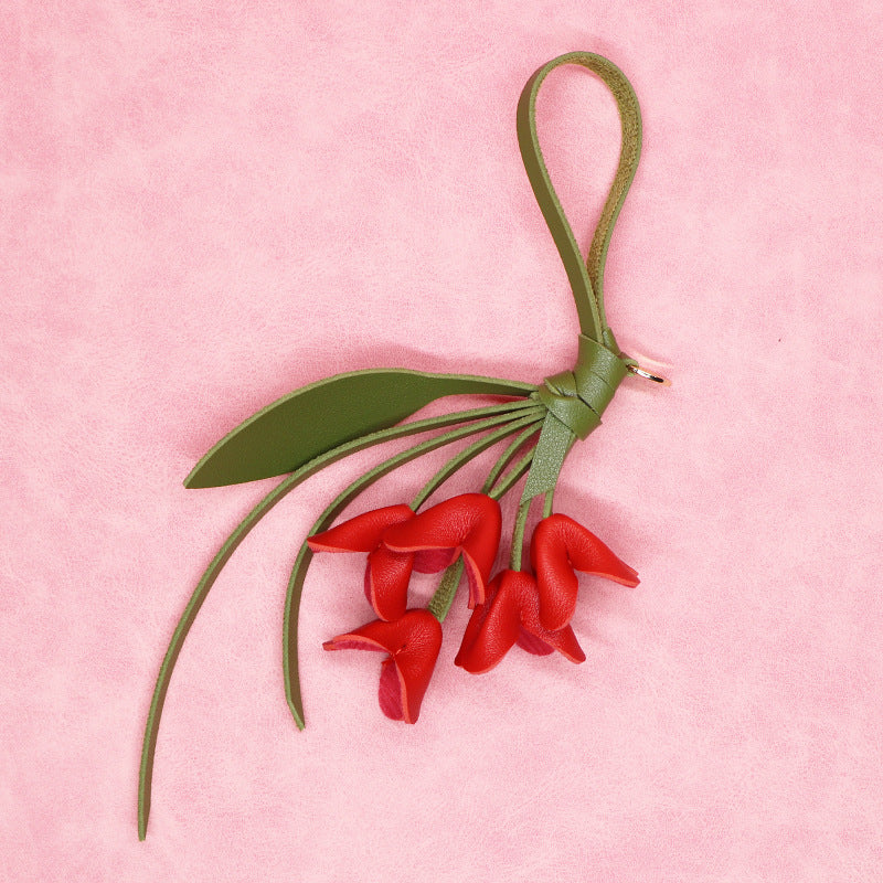 Red PU flower keychain with green strap and leaf perfect for wholesale gifts