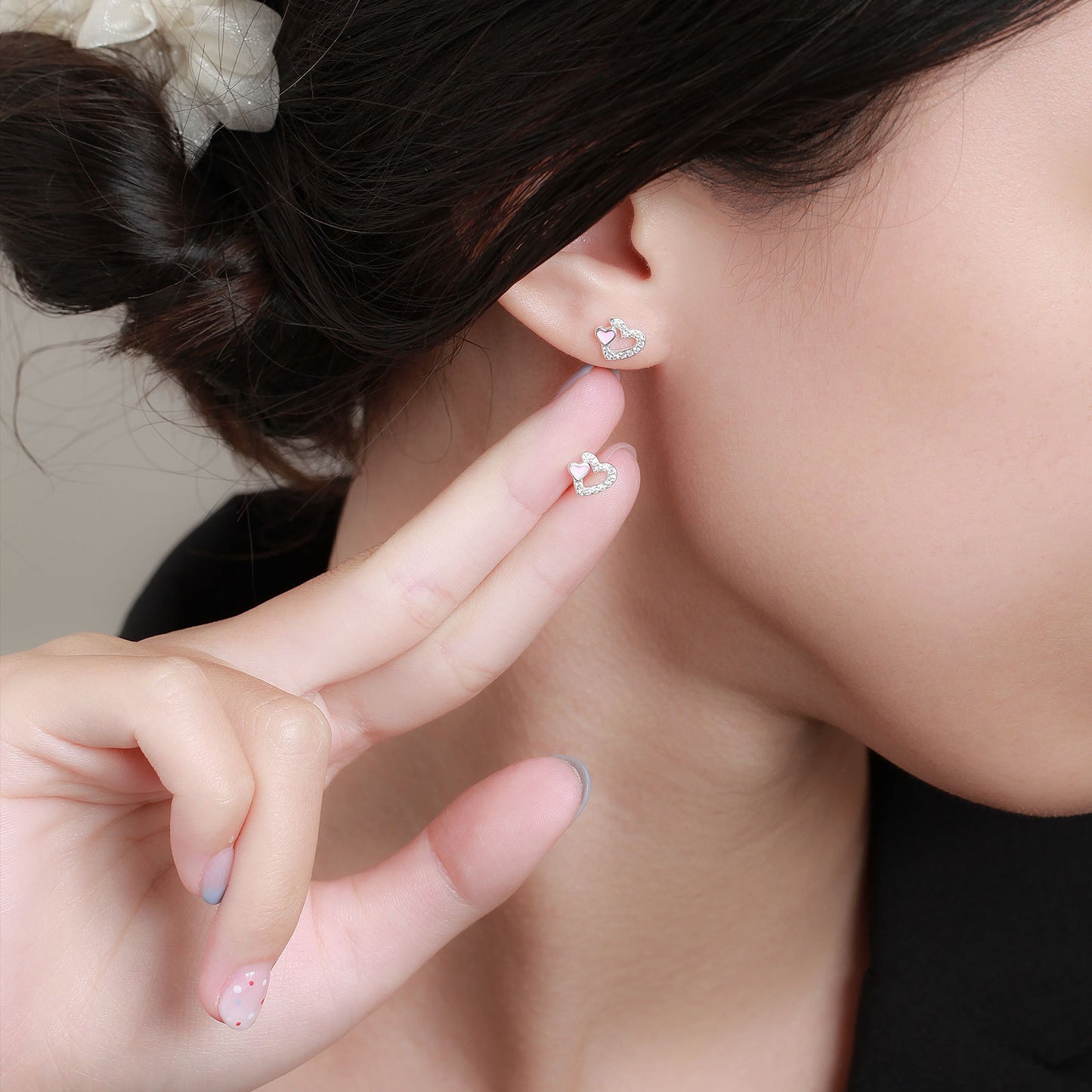 Model wearing S999 silver heart stud earrings for a minimalist and fresh fashion style