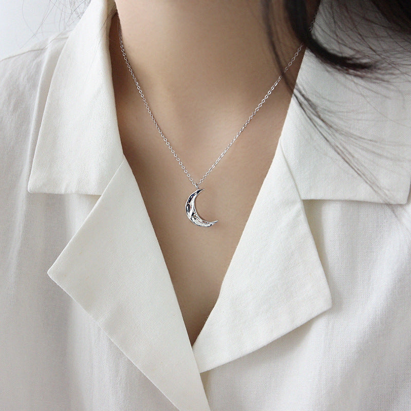 waxing crescent moon pendant necklace layered on model, showcasing minimalist jewelry wholesale style for boutiques and gifting.
