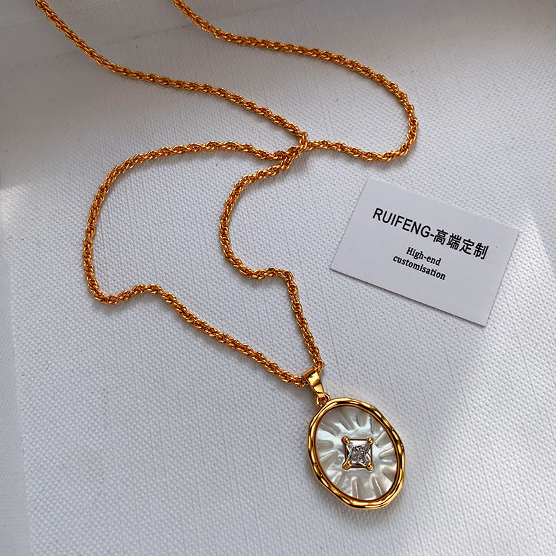 mother of pearl pendant necklace closeup gold plated minimalist jewelry Black May