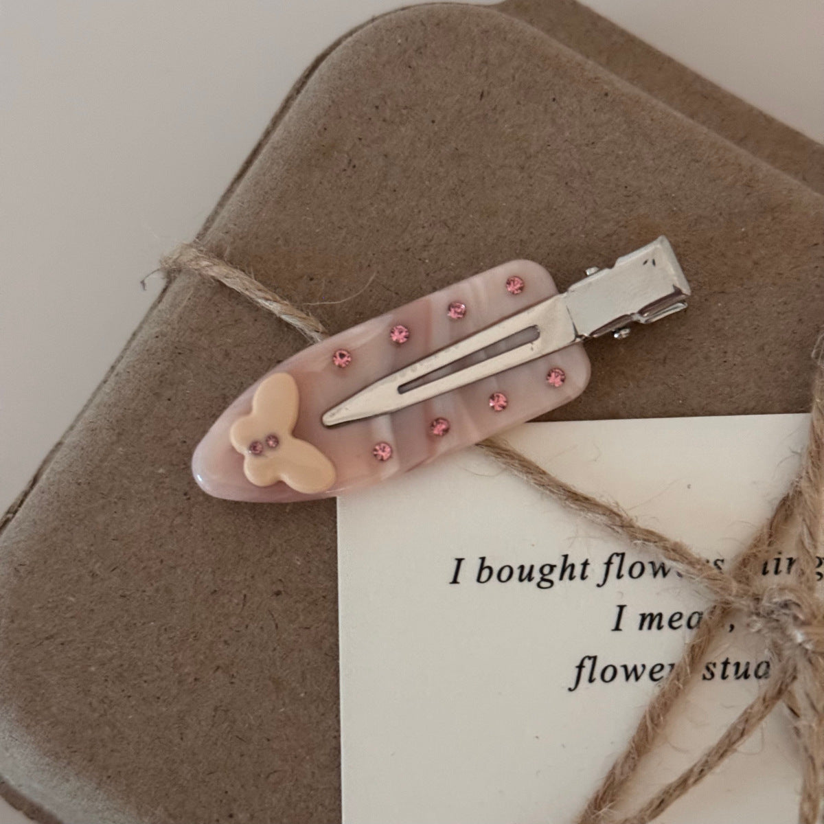 Butterfly popstar clips in marble acetate with sparkling rhinestone crystals.