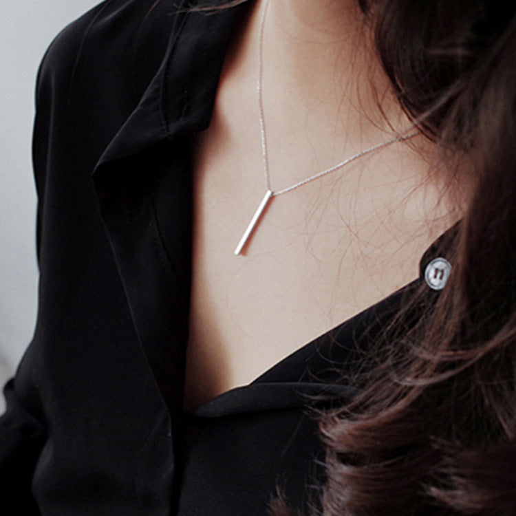 Model wearing minimalist bar pendant necklace from JR Fashion Accessories, perfect for minimalist jewelry wholesale collections
