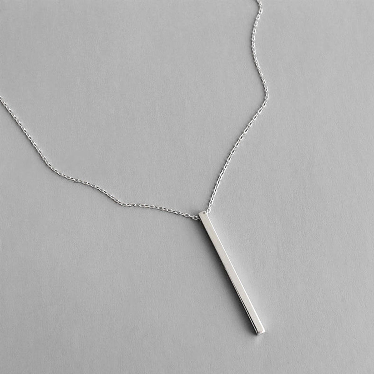 925 silver bar pendant necklace displayed on grey background, ideal for wholesale minimalist jewelry gift sets