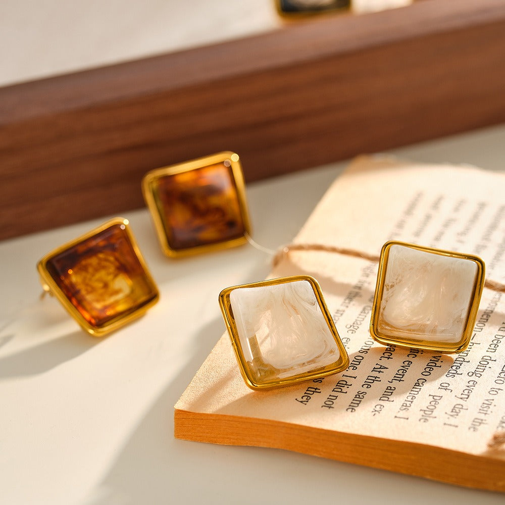 Wholesale square resin stud earrings in caramel and cream colors with polished gold tone frame