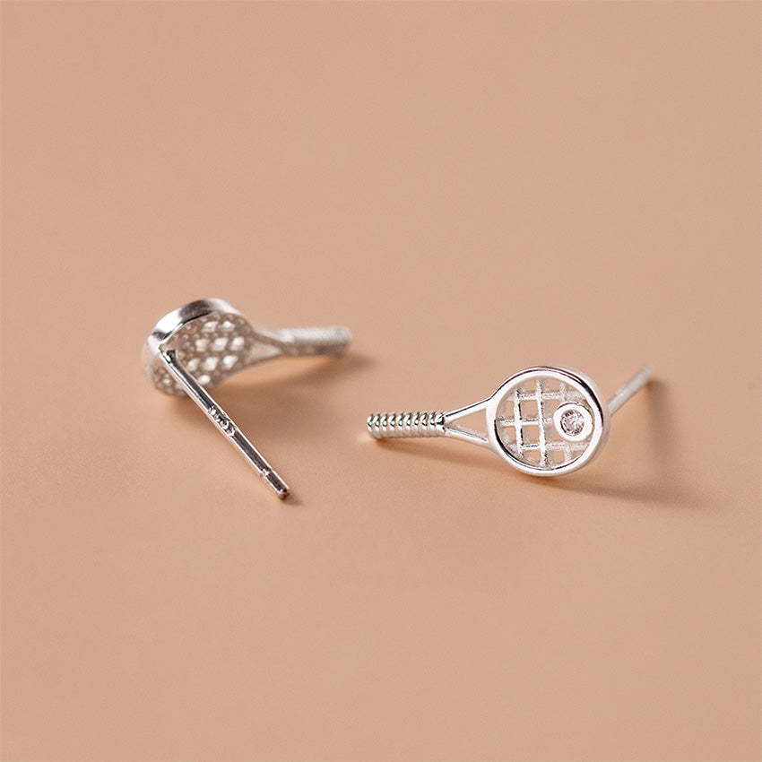 Woman wearing S925 sterling silver tennis racket stud earrings with crystal detail