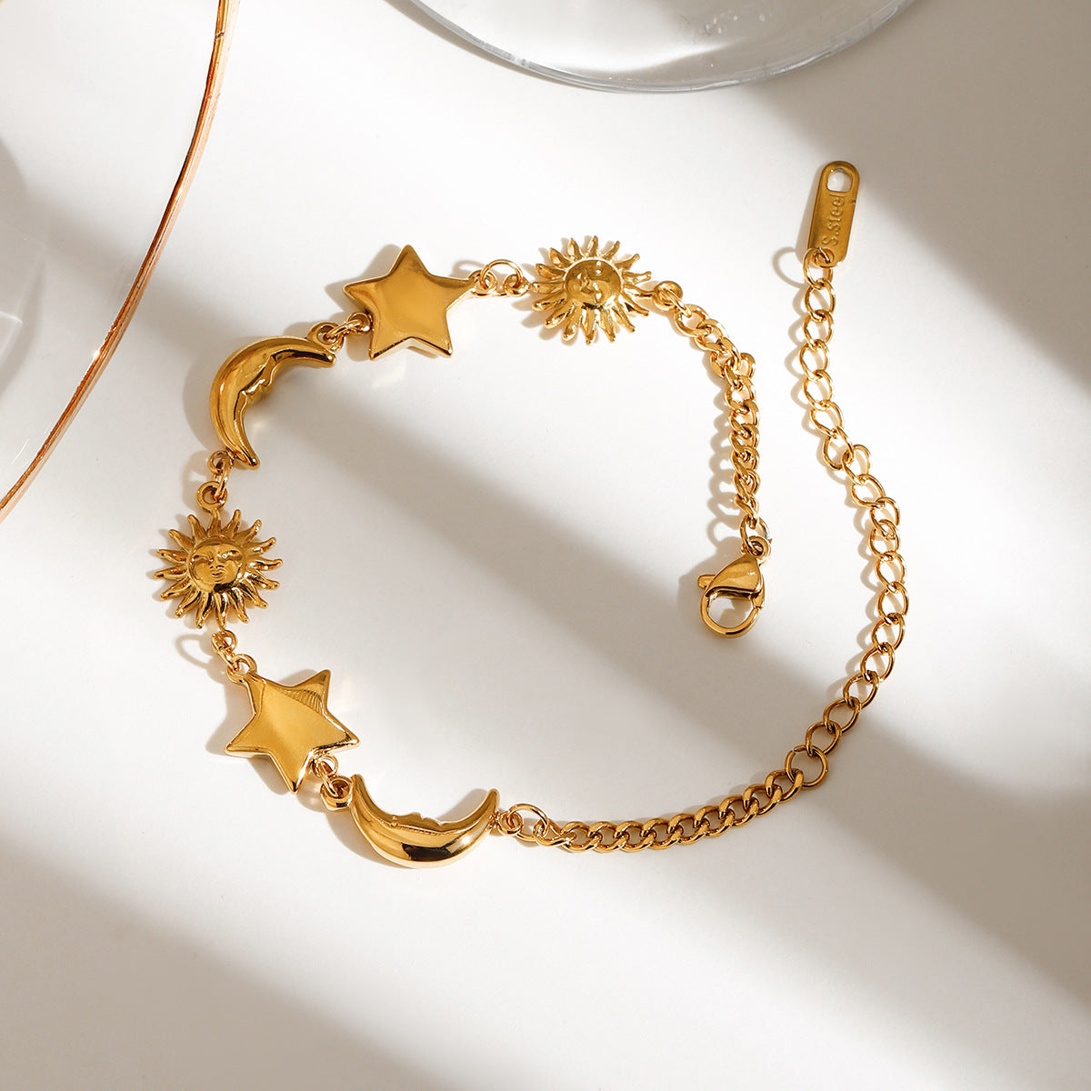 Gold celestial charm bracelet with moon sun star design in stainless steel for wholesale gifts
